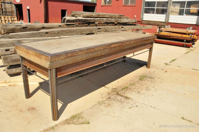 Reclaimed timber community table, steel base