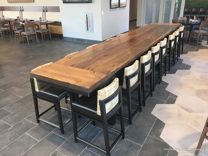 Long communal table with stool seating
